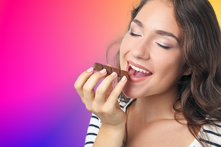 woman eating mushroom chocolate bars